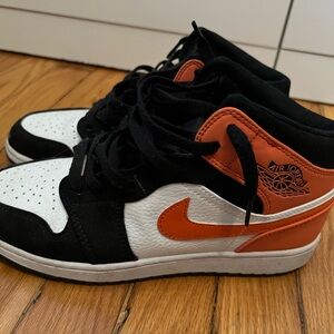 Jordan Black, White, and Orange Sneakers